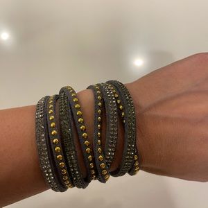 Grey wrap around bracelet with gold and silver beads